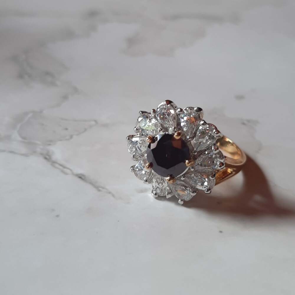 Floral Ring Clear Crystal Petals and Deep Amethyst Center Gold Tone Band